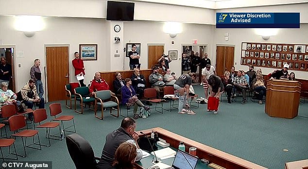 Nicholas Blanchard continued to speak and berate the board as people took their clothes off