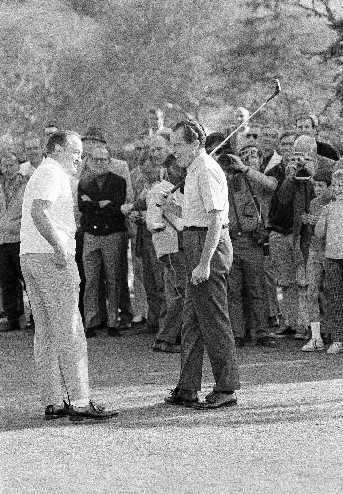 President Richard Nixon shares a laugh with Bob Hope as they prepare to tee off for a round of golf at Lakeside Golf Club in North Hollywood, California, January 3, 1970. President Richard Nixon shares a laugh with Bob Hope as they prepare to tee off for a round of golf at Lakeside Golf Club in North Hollywood, California, January 3, 1970.