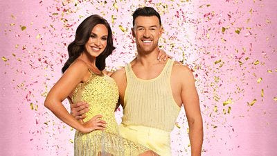 Vicky wears a sparkling yellow bejewelled dress while Kai wears a glittering yellow tank top and yellow trousers.