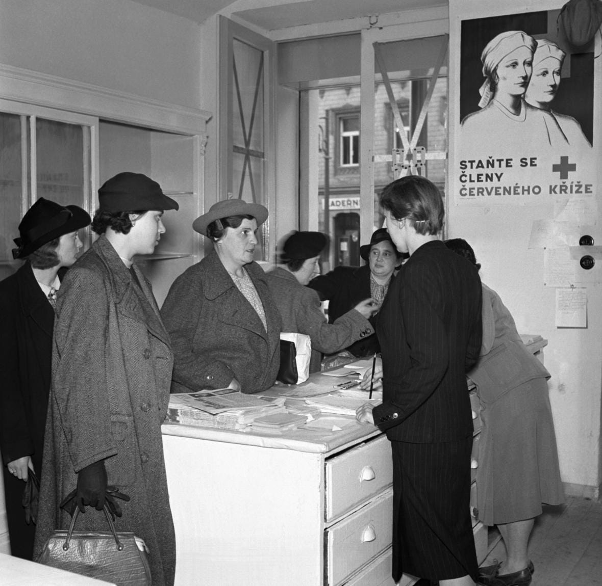 Czech civilians volunteer to donate blood at a Red Cross office in Prague during the Sudetenland Crisis, September 1938.