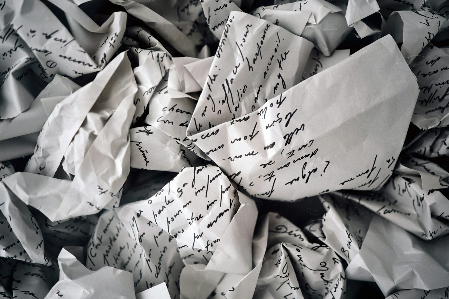 Crumpled up handwritten notes
