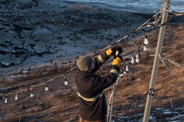 Changing light bulbs for the Site Summit Star in Anchorage, Alaska.