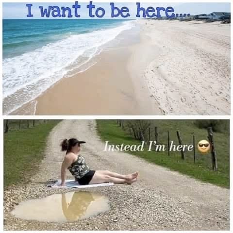 Top half of image features a sandy, tropical beach and the words "I want to be here," and is contrasted by the bottom image of a woman sitting on a towel in a swimsuit next to a puddle in a gravel road, which says "But instead, I'm here." Top half of image features a sandy, tropical beach and the words "I want to be here," and is contrasted by the bottom image of a woman sitting on a towel in a swimsuit next to a puddle in a gravel road, which says "But instead, I'm here."