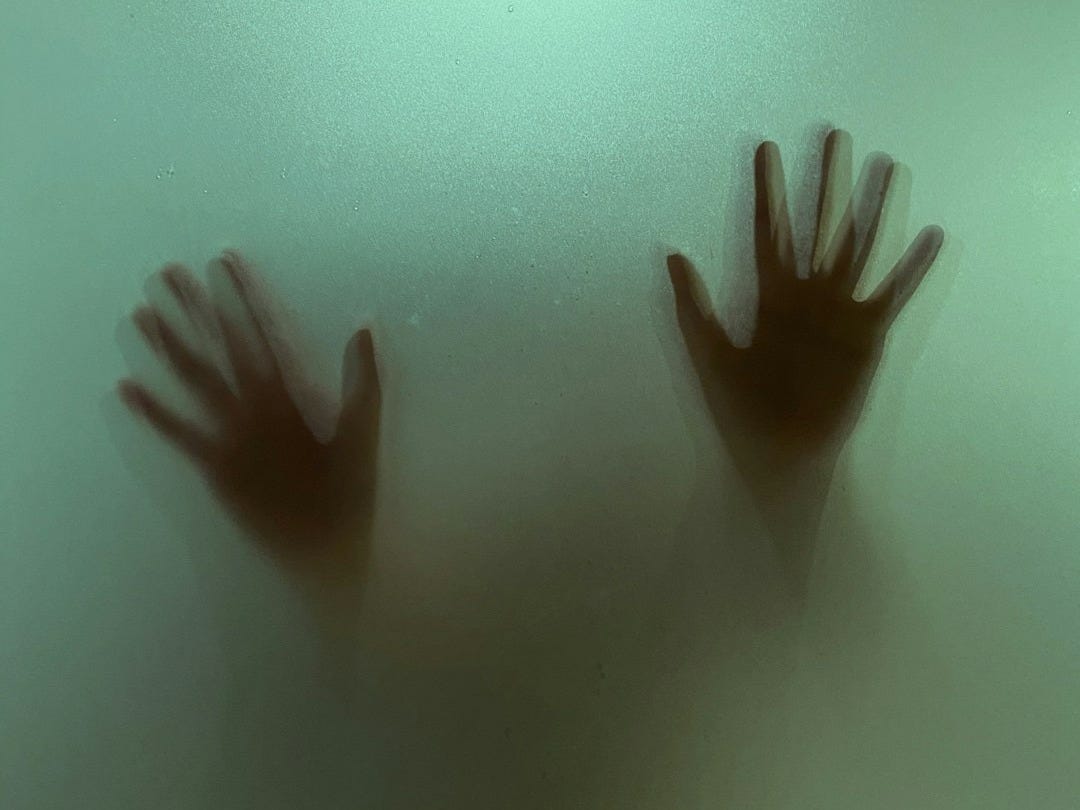 persons hand on water