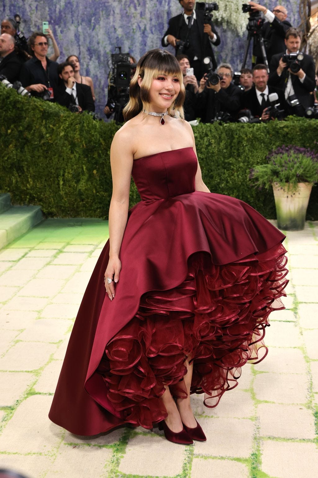 Image may contain Mahdi Elmandjra Pablo Larraín Fashion Clothing Dress Formal Wear Adult Person and Gown