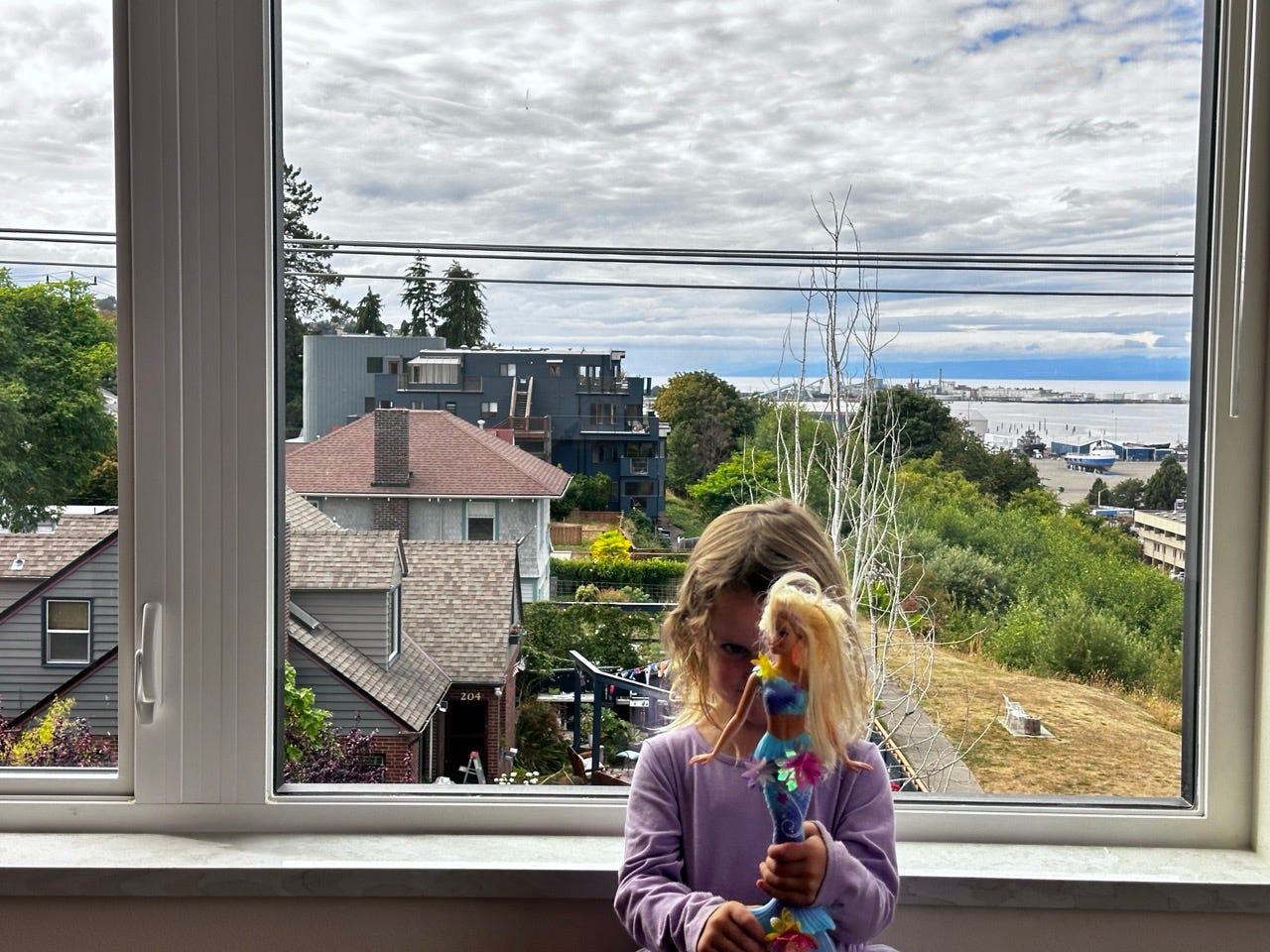 A child holding a doll
Description automatically generated A child holding a doll
Description automatically generated