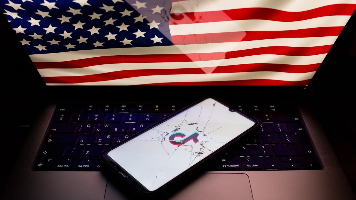 A photo of the U.S. flag and a broken phone screen with the TikTok logo on it 