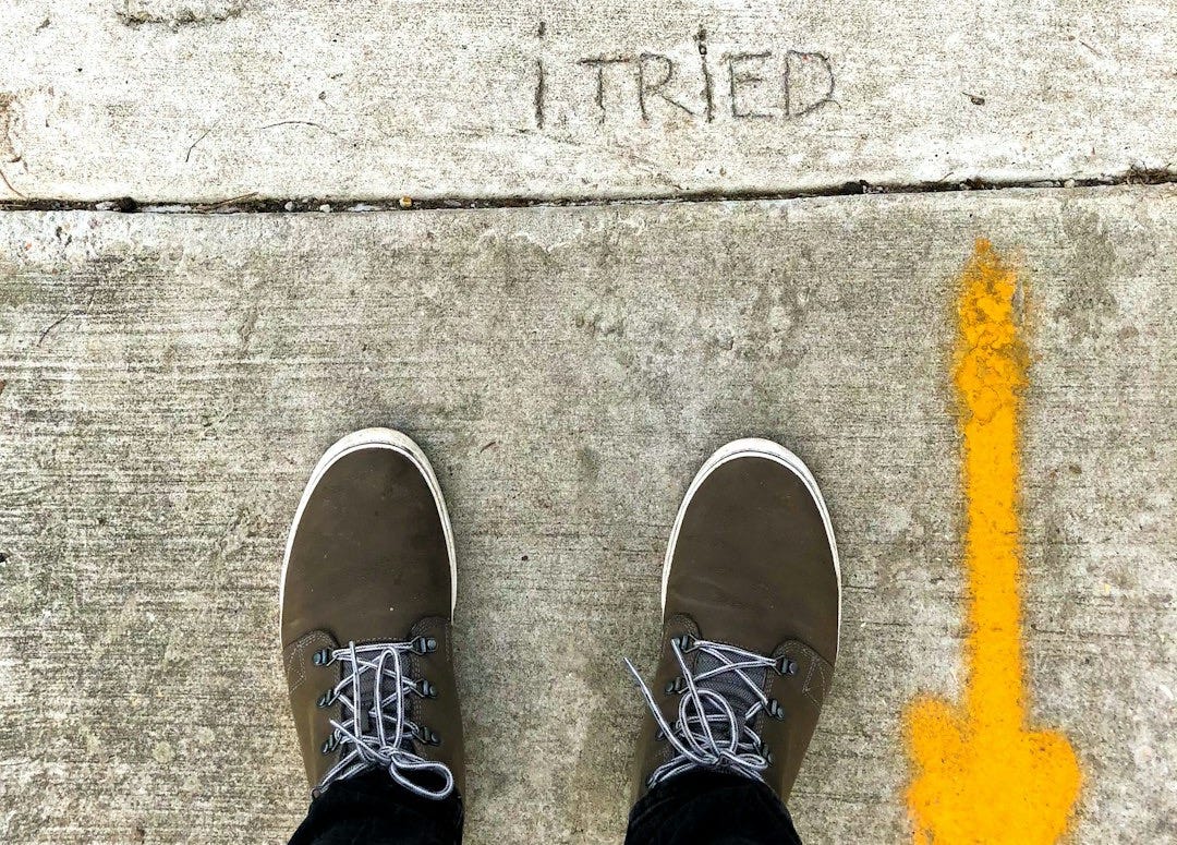 person wearing black and white sneakers. an essay on failure. person wearing black and white sneakers. an essay on failure.