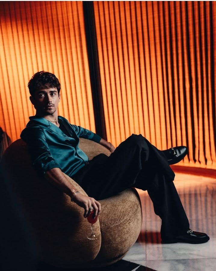 Left: photo of charles leclerc in ad for whiskey. Right: Lewis Hamilton posing in front of Enzo Ferrari's house. Both are dressed in business attire and look polished