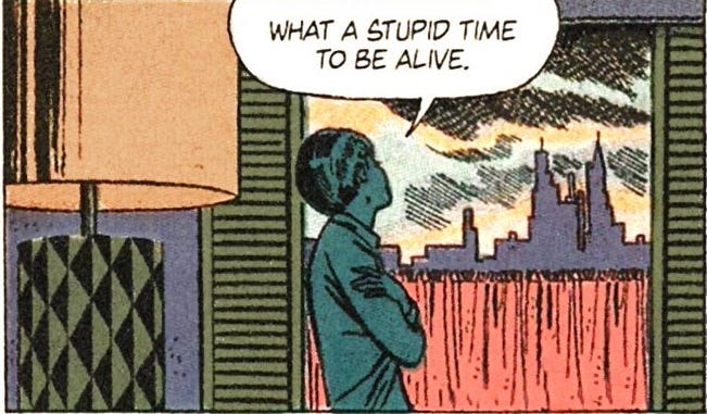 In an old (possibly 1960s?) romance-style comic panel, a slim woman with short hair holds her arms across her chest in a gesture of hopelessness, looks out a window at a distant cityscape, and says 'What a stupid time to be alive.' The dialogue is almost certainly not from the original comic.