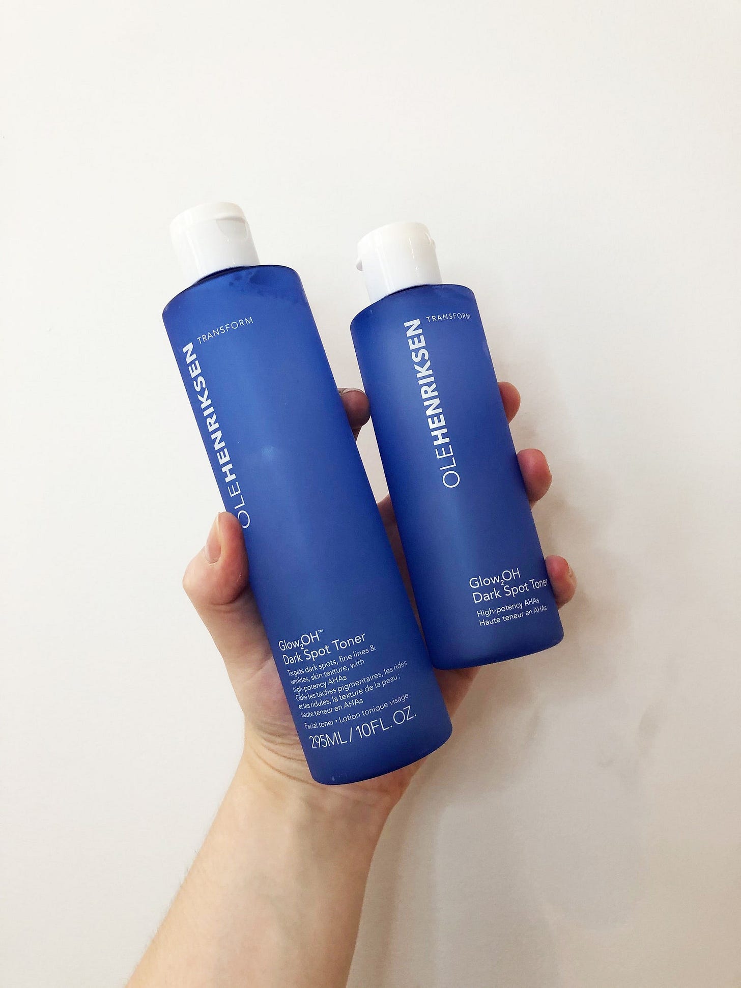 hand holding ole henriksen toners in jumbo and regular sizes hand holding ole henriksen toners in jumbo and regular sizes