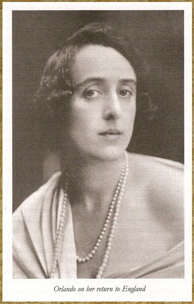 This may contain: an old black and white photo of a woman with pearls on her necklace, looking at the camera This may contain: an old black and white photo of a woman with pearls on her necklace, looking at the camera