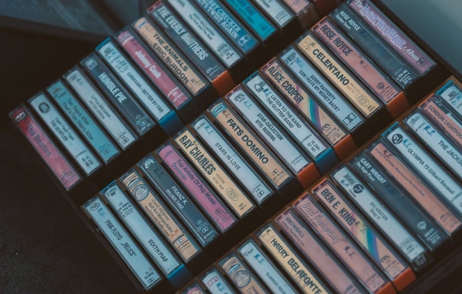 a stack of cassettes sitting on top of each other a stack of cassettes sitting on top of each other
