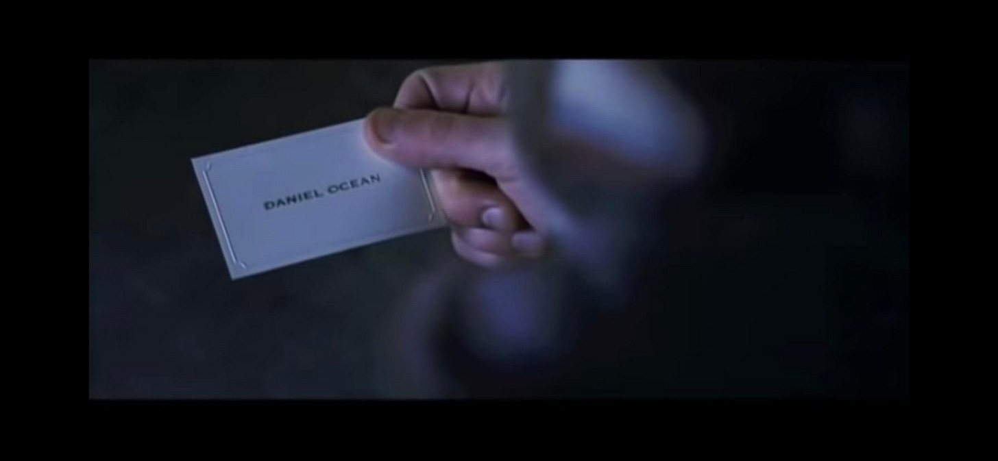 In "Ocean's 11" (2001) Danny Ocean (George Clooney) steals a wallet and  leaves his business card. Look at that subtle off-white colouring. Tasteful  thickness of it. Oh my god it even has