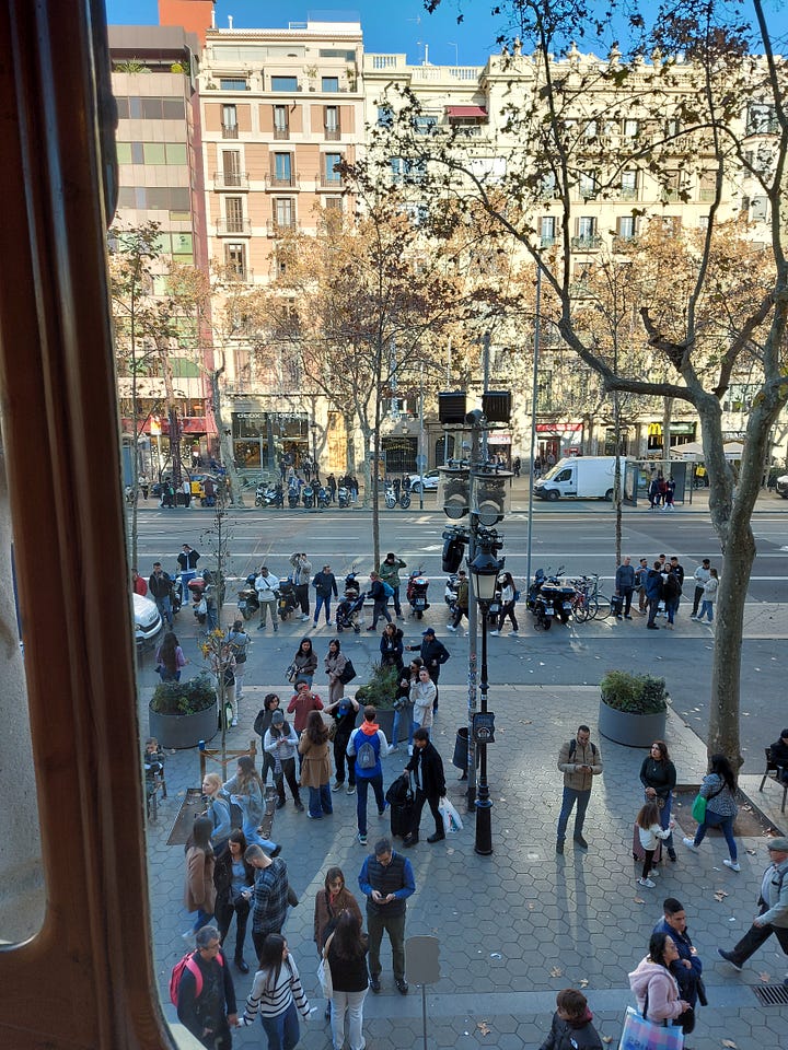 A snapshot of the Passeig de Gracia. Two lanes, service roads, sidewalks, and trees prepare the city well to handle heavy traffic and a dense population. Second image is an old map of the plan to re-do the city in El Fornet, a restaurant just off the Passeig de Gracia.