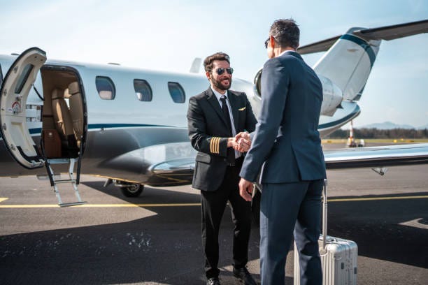 pilot handshake with asian business executive at airport - private jet stock pictures, royalty-free photos & images