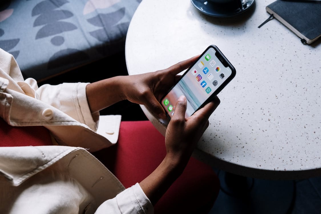 Free Person Holding Black Iphone 5 Stock Photo