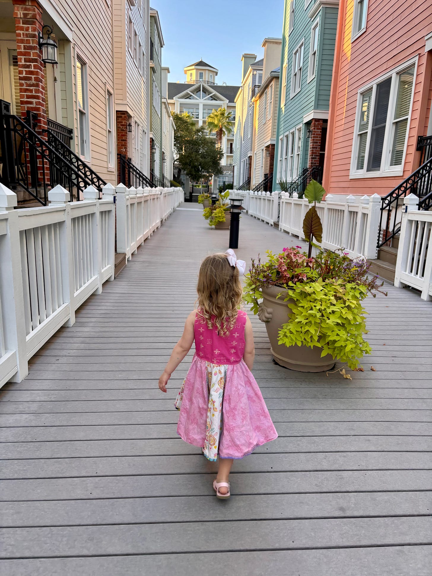 girl walking on the boardwalk in wild dunes