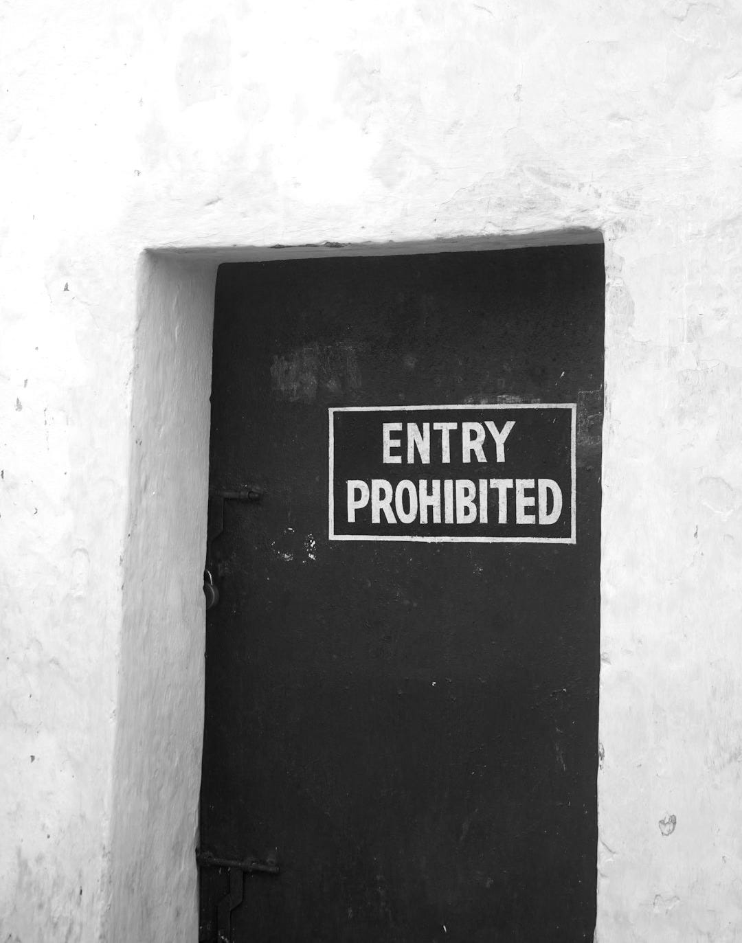 a red door with a sign on it