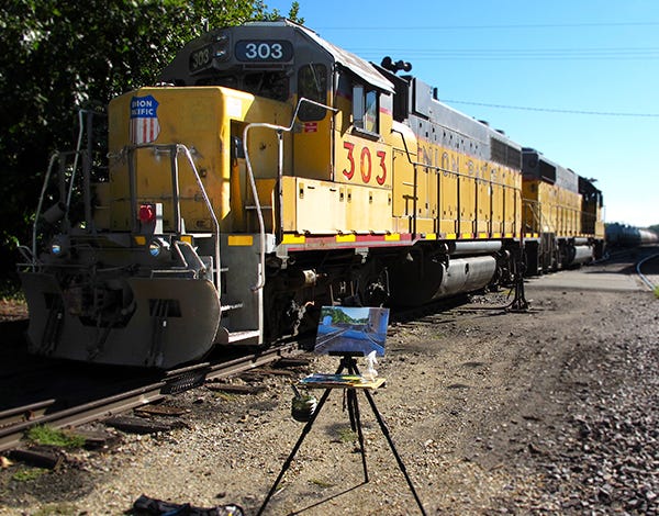 Too Close for Comfort Photo of Freight Train and Artist Easel
