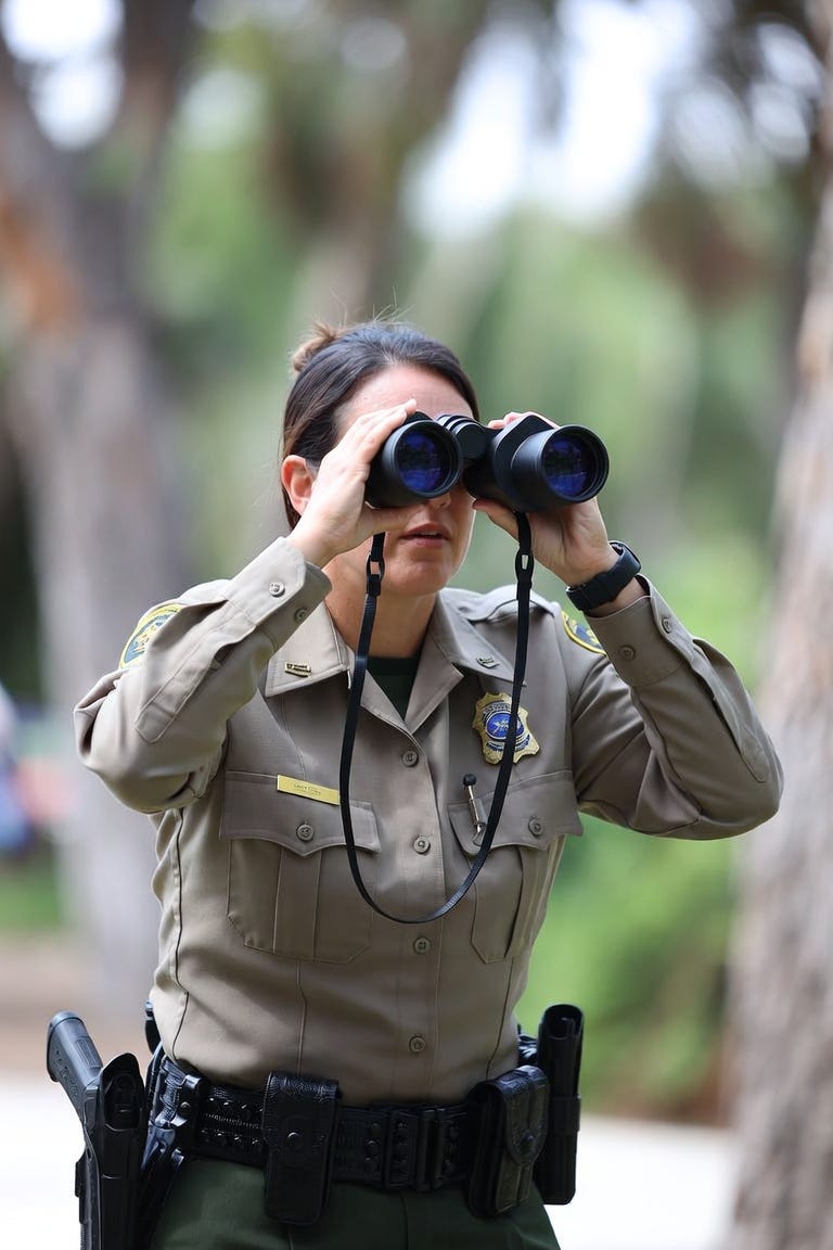 fish and wildlife official spying on critics. no people in the background fish and wildlife official spying on critics. no people in the background