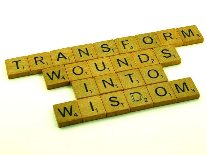 Wooden block saying “transform wounds to wisdom” Wooden block saying “transform wounds to wisdom”