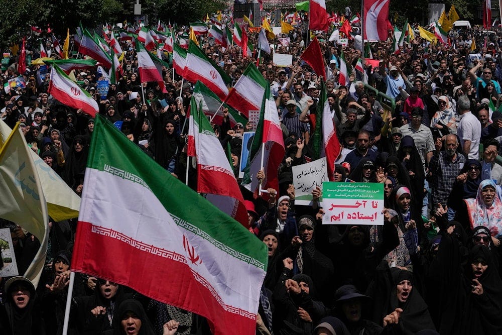 Iranian worshippers carry their country's flags in a protest to condemn Israeli attacks on multiple cities across Iran, after the Friday prayers ceremony in Tehran, Iran, Friday, June 20, 2025. (AP) Iranian worshippers carry their country's flags in a protest to condemn Israeli attacks on multiple cities across Iran, after the Friday prayers ceremony in Tehran, Iran, Friday, June 20, 2025. (AP)