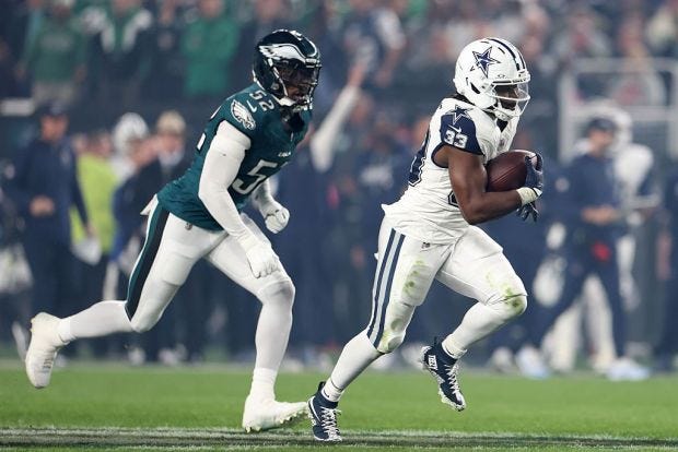 Dallas Cowboys running back Javonte Williams (33) is chased by Philadelphia Eagles edge rusher Jonathan Greenard (52) in the first quarter Monday, Oct. 26, 2026, at Lincoln Financial Field in Philadelphia. (Emilee Chinn/Getty Images) Dallas Cowboys running back Javonte Williams (33) is chased by Philadelphia Eagles edge rusher Jonathan Greenard (52) in the first quarter Monday, Oct. 26, 2026, at Lincoln Financial Field in Philadelphia. (Emilee Chinn/Getty Images)