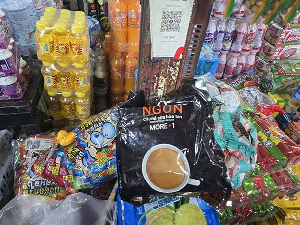 Instant coffee from Vietnam is placed among other consumer products at a market in Koh Kong province in Cambodia. (Photo: Jakkrit Waewkraihong)