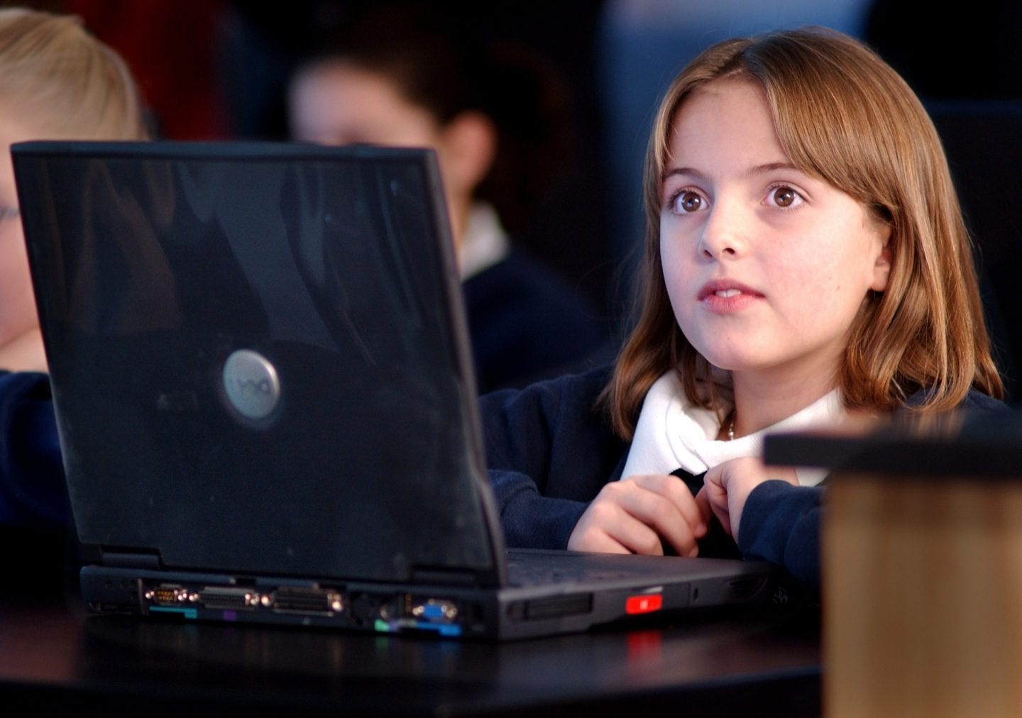 A girl looking at her laptop screen A girl looking at her laptop screen