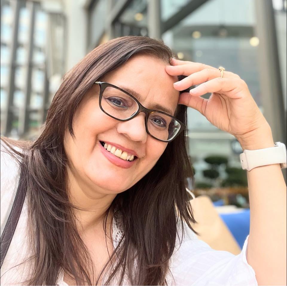 May be an image of 1 person, smiling and glasses