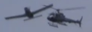 A frame of video taken immediately before a midair collision between a Piper PA-32R and a Eurocopter AS350 that occurred over the Hudson River in 2009.  Source: NBC News / MSNBC
