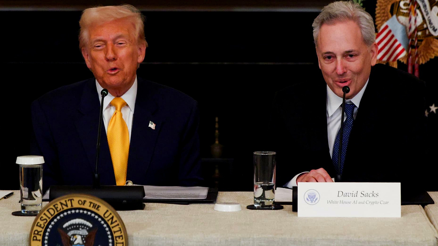 U.S. President Donald Trump sits next to Crypto czar David Sacks at the White House Crypto Summit at the White House in Washington, D.C., U.S.,  March 7, 2025. REUTERS/Evelyn Hockstein