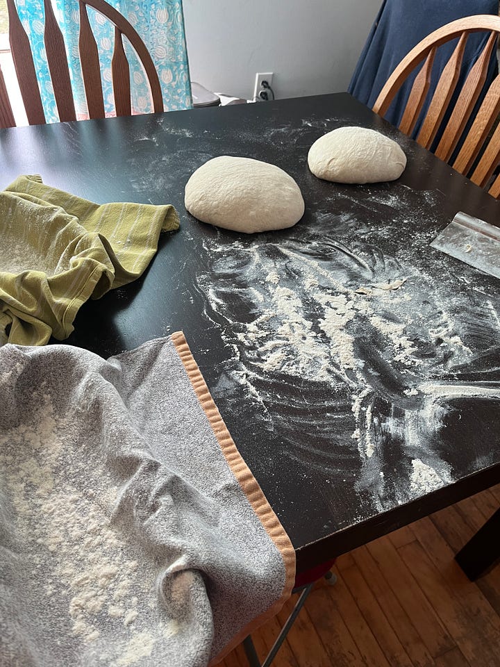 two images: on the left, a couple of balls of bread dough on a dusted countertop. on the right, a loaf of sourdough bread coated in sesame seeds