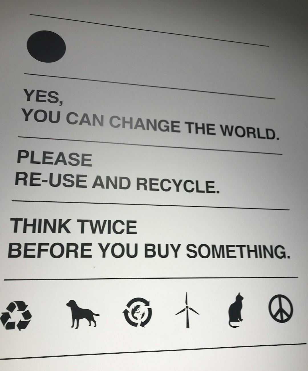 a sign that is on the side of a wall