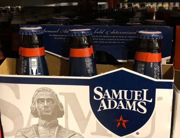 Bottles of Samuel Adams beer are displayed on a shelf at grocery store on May 10, 2019 in San Francisco, California. Boston Beer Company, the second...