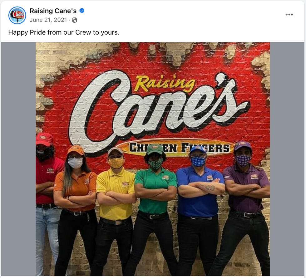 Raising Cane's Facebook picture for pride featuring employees wearing rainbow shirts and masks. Raising Cane's Facebook picture for pride featuring employees wearing rainbow shirts and masks.