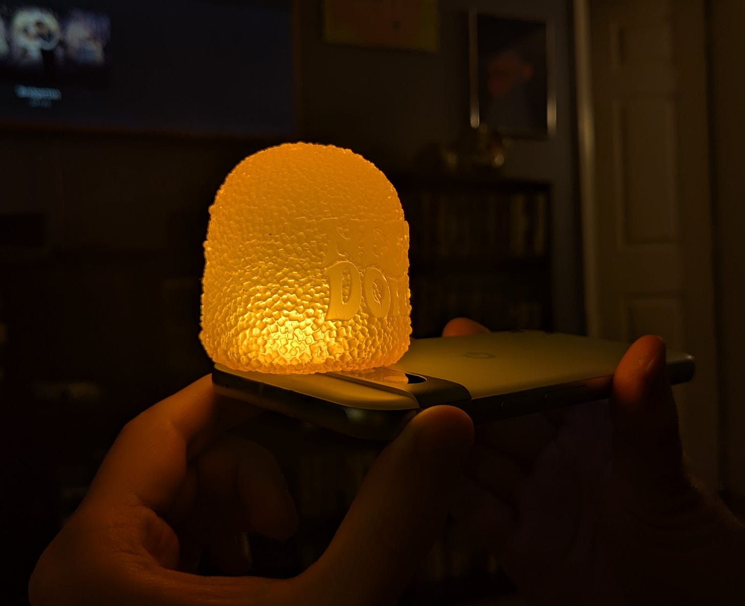 A NeeDoh on a flashlight.