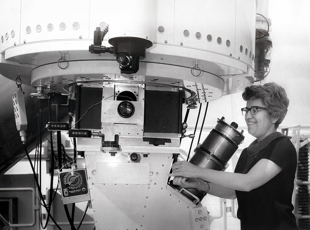 Photo of Rubin adjusting part of a large telescope Photo of Rubin adjusting part of a large telescope
