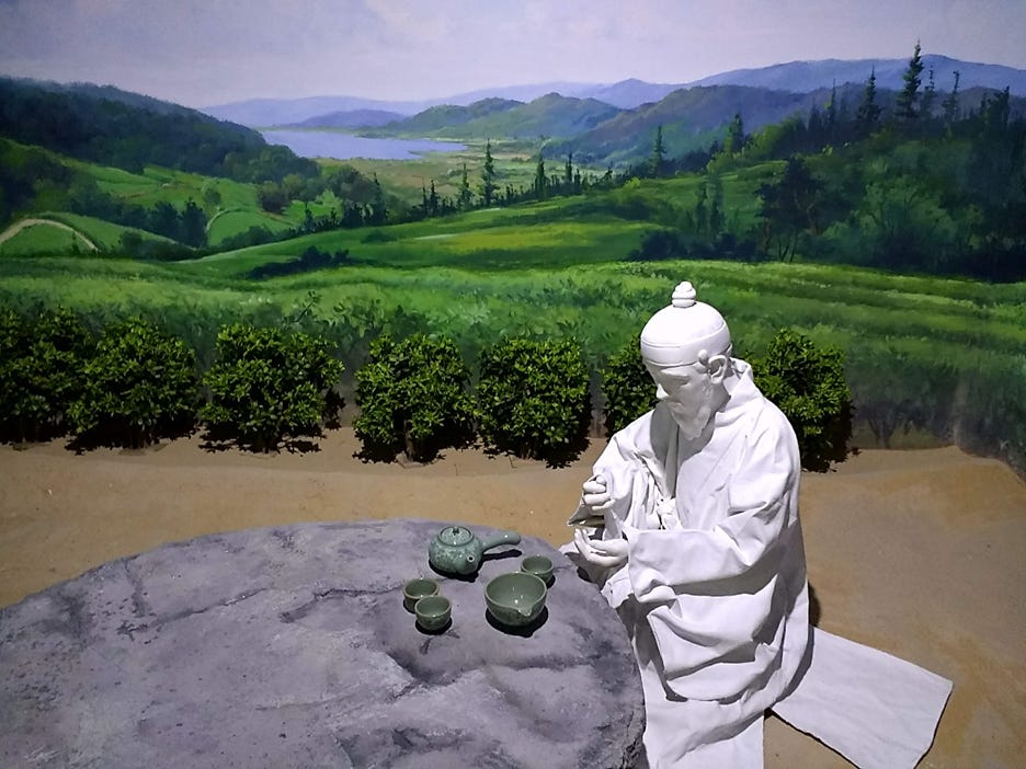 A statue of a person sitting at a table with a landscape behind him
AI-generated content may be incorrect. A statue of a person sitting at a table with a landscape behind him
AI-generated content may be incorrect.