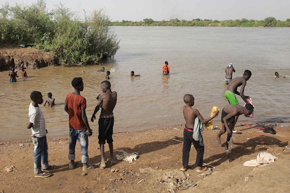 Boys prepare to swim at the Nile River in Khartoum, Sudan, Monday, June 1, 2026. (AP Photo/Marwan Ali) Boys prepare to swim at the Nile River in Khartoum, Sudan, Monday, June 1, 2026. (AP Photo/Marwan Ali)