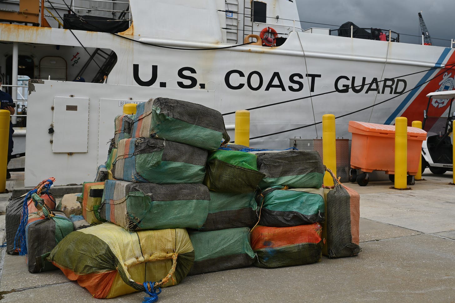 A small portion of more than $72 million in cocaine that the Coast Guard seized after intercepting five cartel drug smuggling boats is offloaded in Miami Beach on Thursday, April 23, 2026. (US Coast Guard photo)