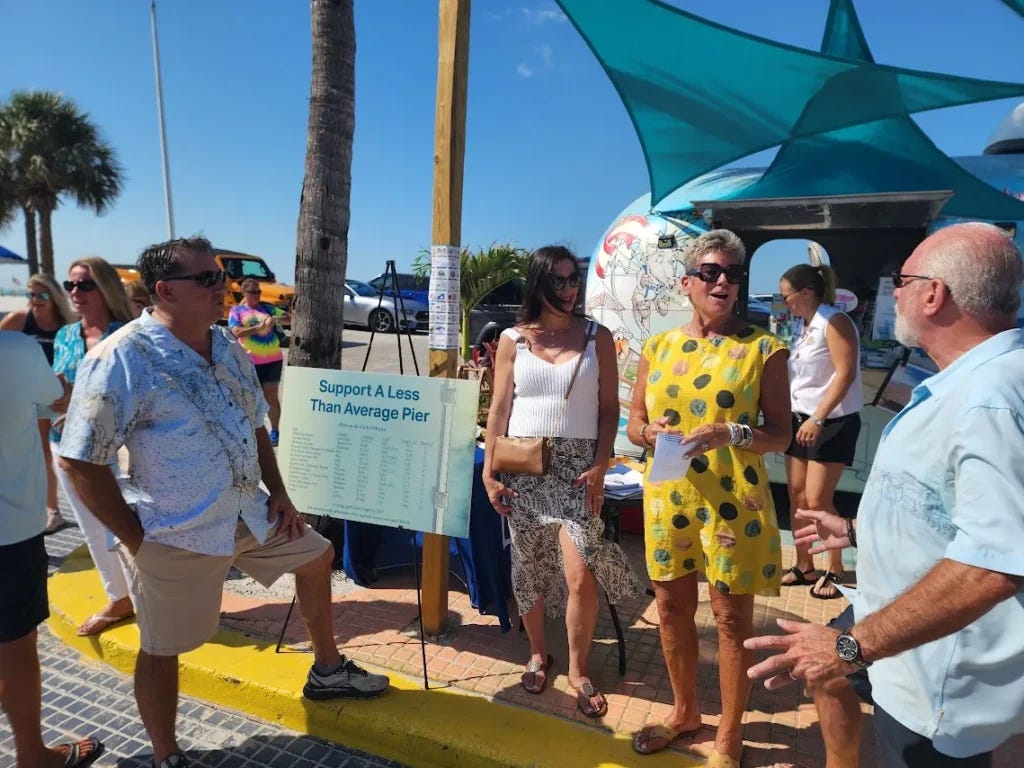 Alan Shanosky, CIndee Shanosky, Council Member Karen Woodson, and Dennis Wagaman discuss the Pier Rebuild at a recent FMB Chamber Friday Power Hour Event in Times Square.