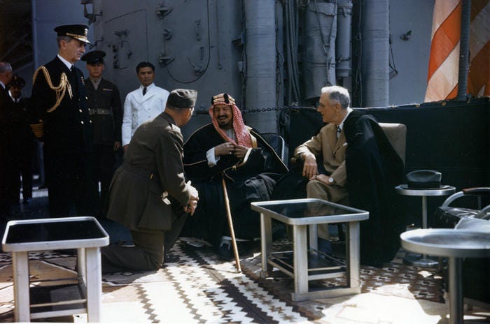 President Roosevelt shakes hands with King Ibn Saud, of Saudi Arabia, on board the US Navy heavy cruiser.