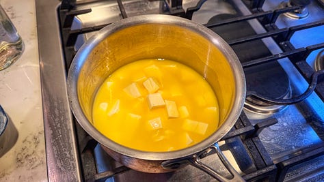Three photos of a pot of butter cubes as they melt