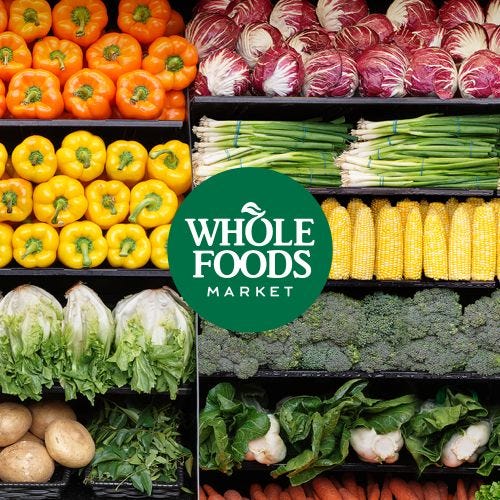 This may contain: the whole foods market is full of fresh fruits and vegetables, including lettuce, carrots, corn, broccoli
