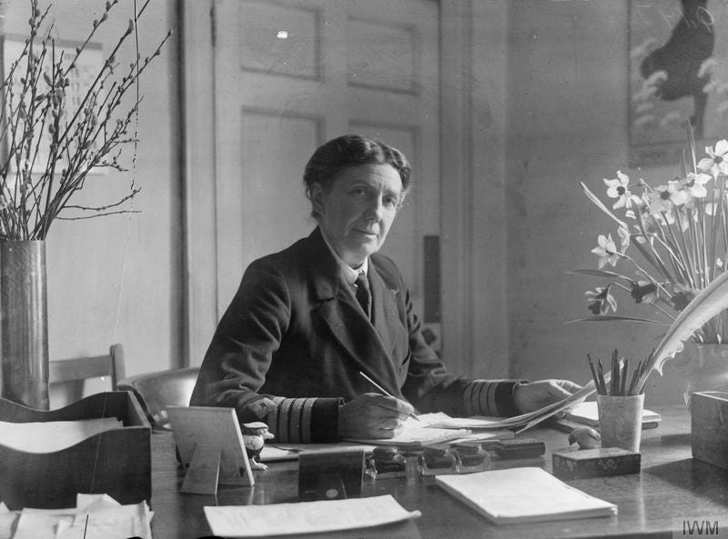 A woman looking very stern at her desk A woman looking very stern at her desk