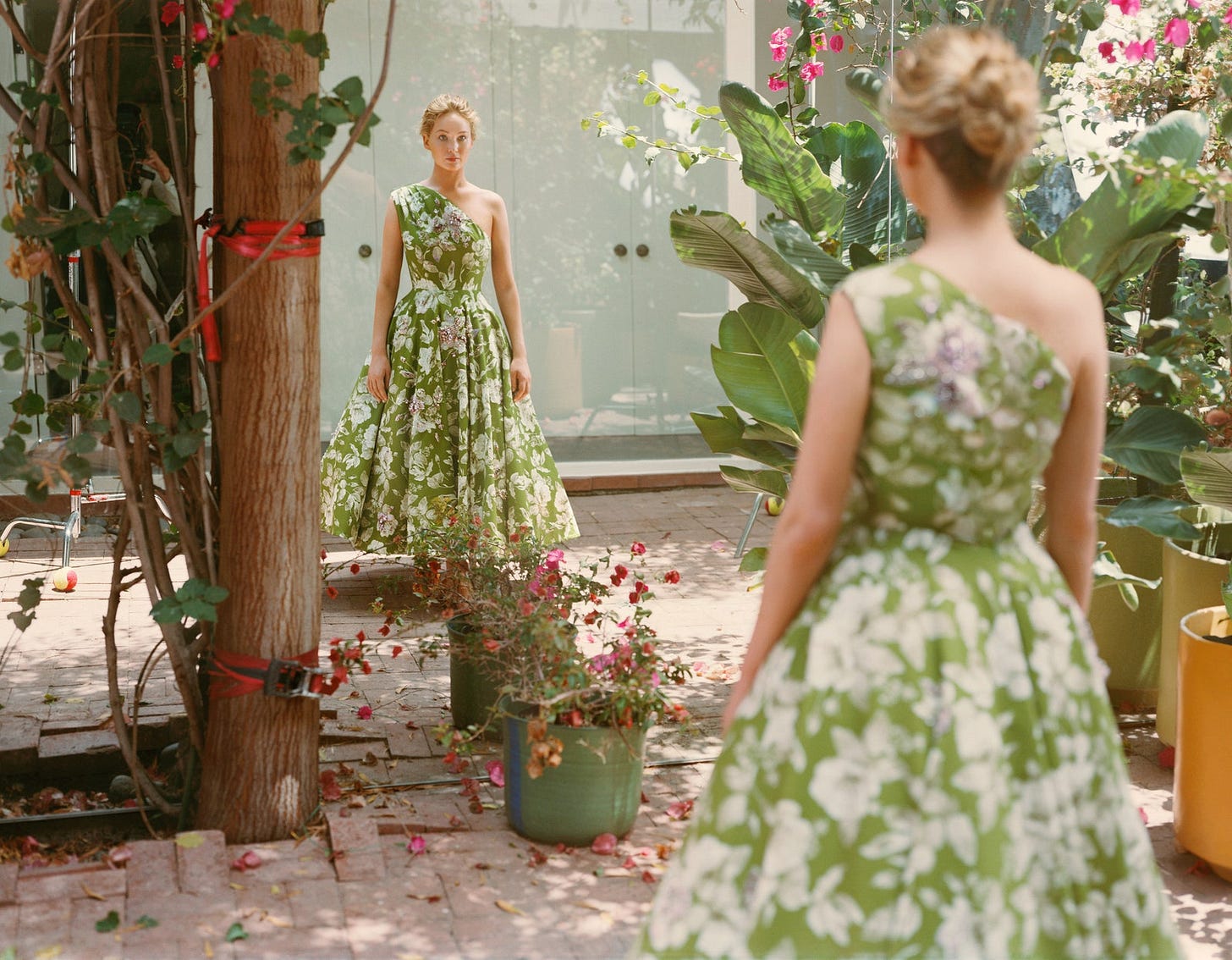 Image may contain Clothing Apparel Evening Dress Fashion Gown Robe Human Person Jennifer Lawrence and Plant