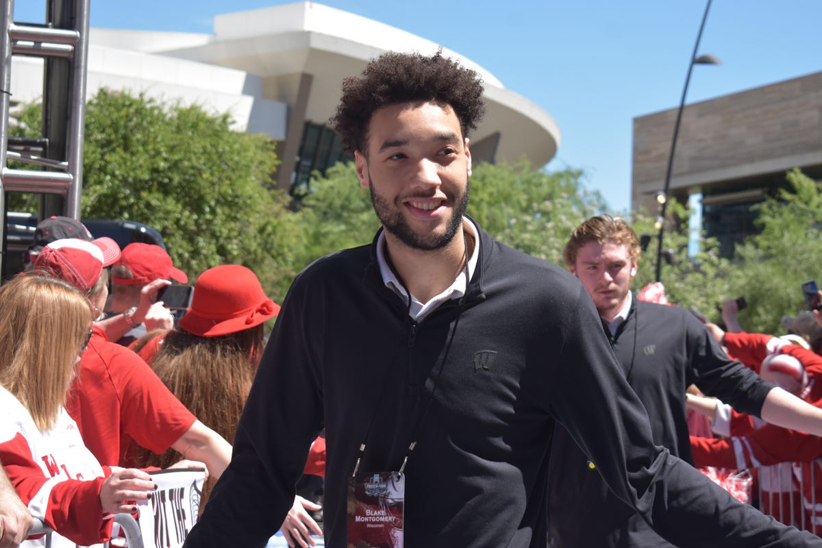 Blake Montgomery in all black smiling in the sun