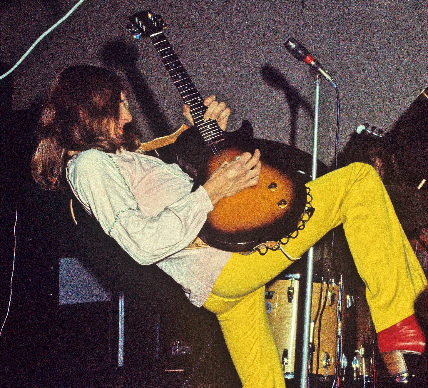 BIRMINGHAM, UNITED KINGDOM - DECEMBER 26: Mick Ralphs of Mott The Hoople performs on stage at Birmingham Town Hall on December 26 1970. BIRMINGHAM, UNITED KINGDOM - DECEMBER 26: Mick Ralphs of Mott The Hoople performs on stage at Birmingham Town Hall on December 26 1970.